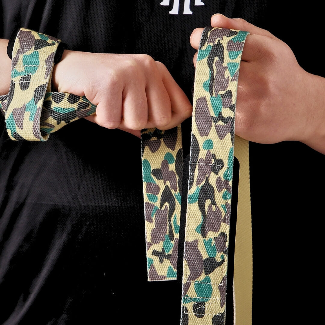 Another view of model with camo lifting straps | Camo lifting straps made from polycotton for powerlifting and weightlifting and strength sports such as deadlifts in the gym.