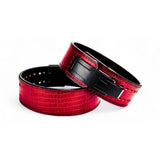 A pair showcasing a striking red crocodile pattern with a sturdy black lever buckle. Designed for elite performance and support, these belts are the ultimate choice for powerlifting.