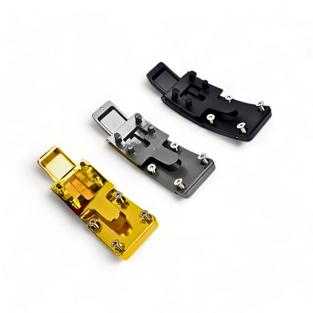 Underside view of akinci strength lever belt buckles in gold, black, and gray, showing secure screws. | Lever buckles compatible with SBD Belt