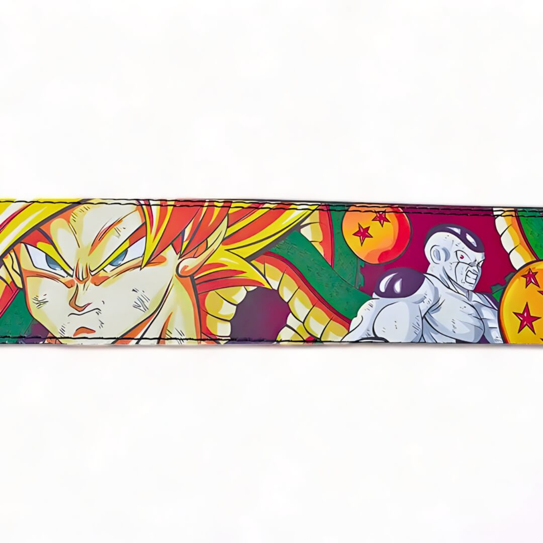 Close-up of the Dragon Ball Z lifting belt displaying Goku and Frieza's detailed artwork, highlighted by the colorful Dragon Balls in the background