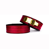 Displaying luxurious red crocodile texture with a gold lever buckle. These belts are designed for lifters who seek unparalleled support and a standout look in the gym.